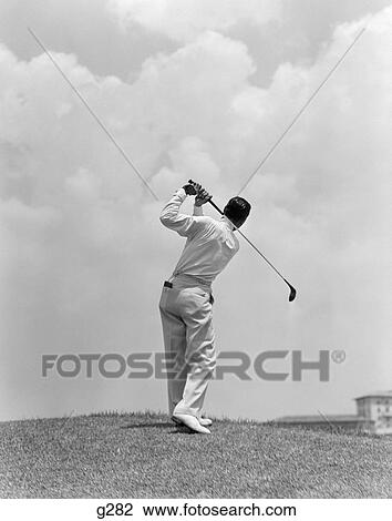 1930S Man Playing Golf Teeing-Off Golf Ball From Tee With Driver Outdoor View Large Photo Image Stock Image - 1930S Man Playing Golf Teeing-Off Golf Ball From Tee With Driver Outdoor. Fotosearch