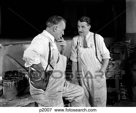 1930S Two Men Workers Painters Talking Together Wearing White Overalls View Large Photo Image Stock Photo - 1930S Two Men Workers Painters Talking Together Wearing White Overalls. Fotosearch
