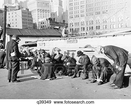 1930S Unemployed Men Sittin In Sunshine On Coenties Slip Dock Lower Manhattan New York City  View Large Photo Image Stock Photo - 1930S Unemployed Men Sittin In Sunshine On Coenties Slip Dock Lower Manhattan New York City . Fotosearch
