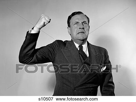 1940S 1950S Man Raising Fist In Anger Speaking Out View Large Photo Image Stock Photo - 1940S 1950S Man Raising Fist In Anger Speaking Out. Fotosearch