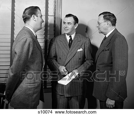 1940S 1950S Three Businessmen Salesmen Talking Together In Office View Large Photo Image Picture - 1940S 1950S Three Businessmen Salesmen Talking Together In Office. Fotosearch
