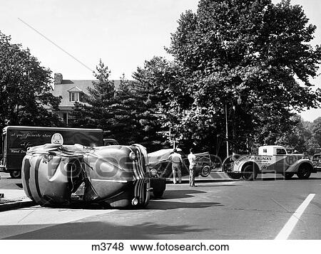 1940S Convertible Towed Away By Tow Truck After Traffic Accident With Sedan Outdoor View Large Photo Image Stock Photo - 1940S Convertible Towed Away By Tow Truck After Traffic Accident With Sedan Outdoor. Fotosearch