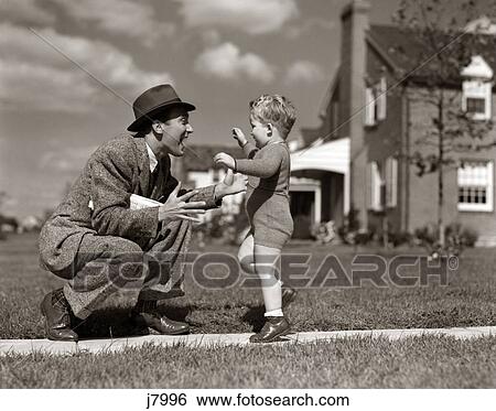 1940S Father Greeting Son Running Towards Him On Sidewalk View Large Photo Image Stock Photograph - 1940S Father Greeting Son Running Towards Him On Sidewalk. Fotosearch