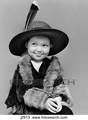 1940S Girl In Oversized Velvet Dress Hat & Furs With Eyes Cast To Side & Tongue Sticking Partially Out View Large Photo Image Stock Image - 1940S Girl In Oversized Velvet Dress Hat & Furs With Eyes Cast To Side & Tongue Sticking Partially Out. Fotosearch