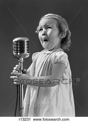 1940S Little Girl Making Face Singing Into Microphone View Large Photo Image Stock Image - 1940S Little Girl Making Face Singing Into Microphone. Fotosearch
