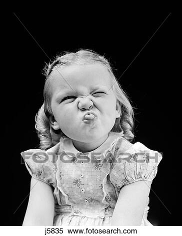 Stock Photography - 1940S Portrait Of Girl Sticking Out Tongue Wrinkled Up Nose. Fotosearch