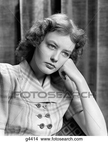 1940S Portrait Of Woman Resting Head Leaning On Hand Looking Worried And Sad View Large Photo Image Picture - 1940S Portrait Of Woman Resting Head Leaning On Hand Looking Worried And Sad. Fotosearch
