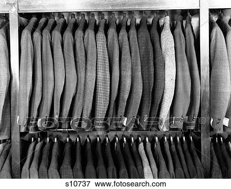 1940S Rack Of Men'S Wool Jackets Hanging In Retail Store Men'S Fashion Clothing Suits View Large Photo Image Stock Photo - 1940S Rack Of Men'S Wool Jackets Hanging In Retail Store Men'S Fashion Clothing Suits. Fotosearch
