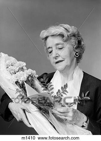 1950S 1960S Elderly Woman Receiving A Bouquet Of Carnations Reading The Card View Large Photo Image Stock Image - 1950S 1960S Elderly Woman Receiving A Bouquet Of Carnations Reading The Card . Fotosearch