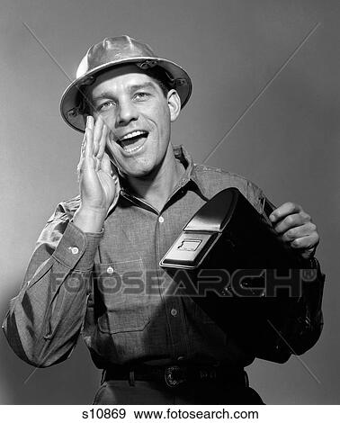 1950S 1960S Man Worker In Hard Hat Yelling Carrying Lunch Box View Large Photo Image Stock Photo - 1950S 1960S Man Worker In Hard Hat Yelling Carrying Lunch Box. Fotosearch