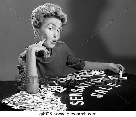1950S 1960S Portrait Blonde Woman Looking At Camera Spelling Out Sensational Sale With Cutout Graphic Design Letters View Large Photo Image Stock Photograph - 1950S 1960S Portrait Blonde Woman Looking At Camera Spelling Out Sensational Sale With Cutout Graphic Design Letters. Fotosearch