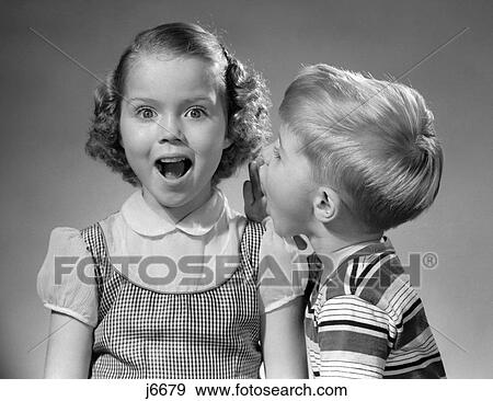 1950S Boy Whispering In Girl'S Ear View Large Photo Image Stock Photo - 1950S Boy Whispering In Girl'S Ear. Fotosearch