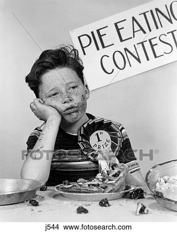 1950S Boy Wins 1St Prize At Pie-Eating Contest And Looks Sick View Large Photo Image Picture - 1950S Boy Wins 1St Prize At Pie-Eating Contest And Looks Sick. Fotosearch
