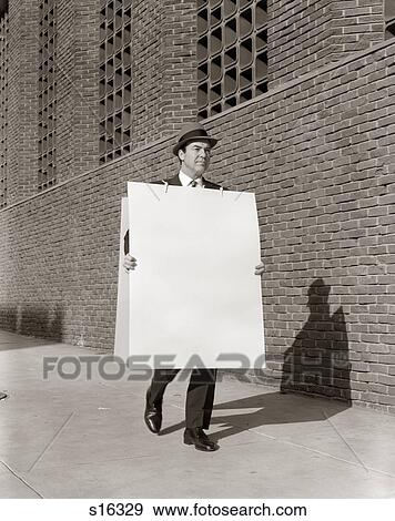 Stock Photo - 1950S Businessman Walking Sidewalk Wearing Advertising Sandwich Board . Fotosearch