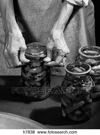 1950S Close-Up Of Elderly Woman'S Hands Sealing Lid On Jar Of Home-Made Pickles View Large Photo Image Stock Photo - 1950S Close-Up Of Elderly Woman'S Hands Sealing Lid On Jar Of Home-Made Pickles. Fotosearch