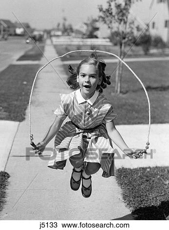 1950S Girl Jumping Rope On Sidewalk View Large Photo Image Stock Image - 1950S Girl Jumping Rope On Sidewalk. Fotosearch