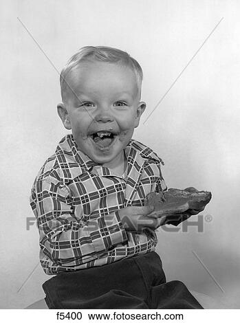 1950S Laughing Boy Wearing A Plaid Shirt With Jam On His Face & Mouth Holding A Slice Of Bread With Both Hands Looking At Camera View Large Photo Image Stock Image - 1950S Laughing Boy Wearing A Plaid Shirt With Jam On His Face & Mouth Holding A Slice Of Bread With Both Hands Looking At Camera. Fotosearch