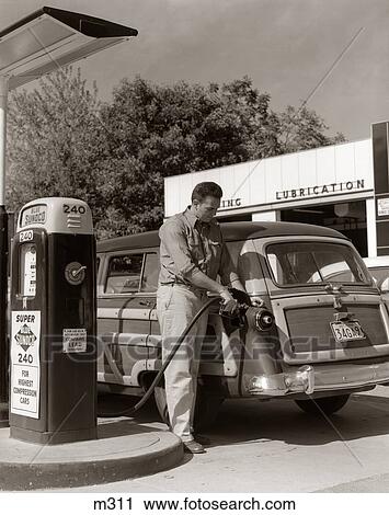 1950S Service Station Attendant Man Filling Gas Tank Of Wood Body Station Wagon View Large Photo Image Stock Image - 1950S Service Station Attendant Man Filling Gas Tank Of Wood Body Station Wagon . Fotosearch