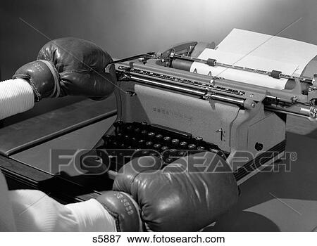 1950S Symbolic Hands Wearing Boxing Gloves Returning Carriage On Office Typewriter View Large Photo Image Stock Photo - 1950S Symbolic Hands Wearing Boxing Gloves Returning Carriage On Office Typewriter. Fotosearch