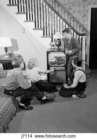 1950S Teen Boys & Girls In Living Room Watching Tv View Large Photo Image Picture - 1950S Teen Boys & Girls In Living Room Watching Tv. Fotosearch