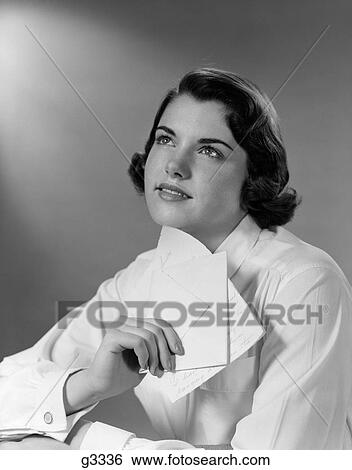 Stock Photograph - 1950S Teenage Girl Reading A Letter And Dreaming A Daydream. Fotosearch