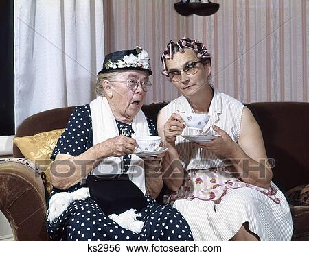 1950S Two Elderly Drinking Tea Gossiping Hair In Curlers View Large Photo Image Stock Photograph - 1950S Two Elderly Drinking Tea Gossiping Hair In Curlers . Fotosearch