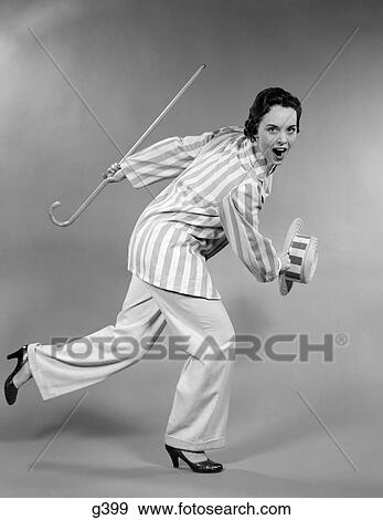 1950S Woman In Striped Jacket Holding Cane & Straw Hat Shuffling Forward In Dance View Large Photo Image Stock Photo - 1950S Woman In Striped Jacket Holding Cane & Straw Hat Shuffling Forward In Dance. Fotosearch