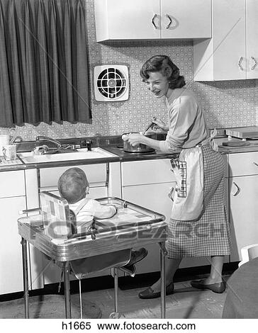 1950s-woman-mother-in-home-kitchen-stock-photography__h1665.jpg