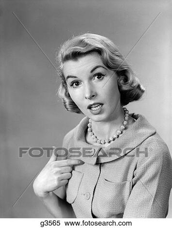 1950S Woman Pointing To Herself Quizzical Expression Indoor View Large Photo Image Stock Photography - 1950S Woman Pointing To Herself Quizzical Expression Indoor. Fotosearch
