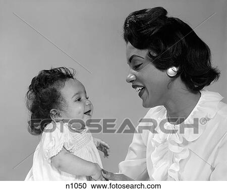 1960S African-American Mother Smiling At Baby View Large Photo Image Stock Image - 1960S African-American Mother Smiling At Baby . Fotosearch