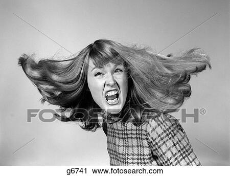 1960S Angry Woman Yelling Gnashing Teeth Hair Flying Looking At Camera View Large Photo Image Stock Image - 1960S Angry Woman Yelling Gnashing Teeth Hair Flying Looking At Camera. Fotosearch