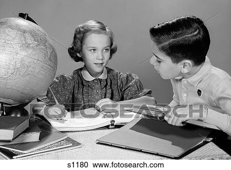 1960S Boy And Girl Doing Homework Together Globe And Books On Table Studio Indoor View Large Photo Image Stock Image - 1960S Boy And Girl Doing Homework Together Globe And Books On Table Studio Indoor. Fotosearch