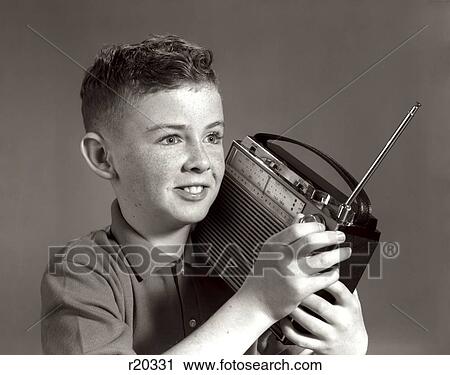 1960S Boy Listening To Portable Radio Indoor View Large Photo Image Stock Image - 1960S Boy Listening To Portable Radio Indoor. Fotosearch