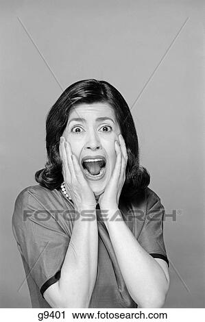 1960S Brunette Woman Screaming Mouth Wide Open Hands To Face Facial Expression Fear Scream Surprise Character Funny Face View Large Photo Image Stock Image - 1960S Brunette Woman Screaming Mouth Wide Open Hands To Face Facial Expression Fear Scream Surprise Character Funny Face . Fotosearch
