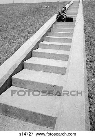 1960S Businessman Crouched In Middle Of Long Flight Of Cement Stairs With Briefcase Set Down In Front Of Him View Large Photo Image Stock Photo - 1960S Businessman Crouched In Middle Of Long Flight Of Cement Stairs With Briefcase Set Down In Front Of Him. Fotosearch