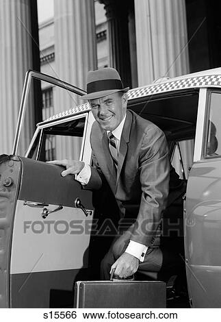 1960S Businessman Holding Briefcase Getting Out Of Taxi Cab Smiling Looking At Camera View Large Photo Image Stock Photograph - 1960S Businessman Holding Briefcase Getting Out Of Taxi Cab Smiling Looking At Camera. Fotosearch