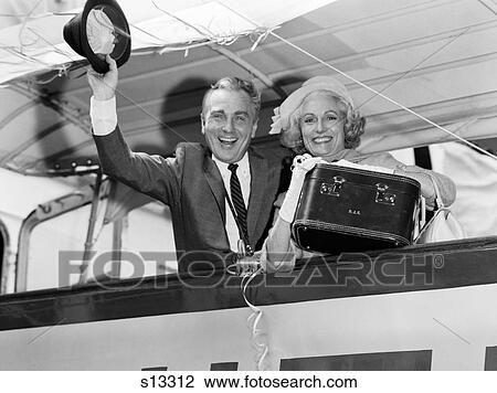 1960S Elder Couple Husband And Wife Smiling Waving From Cruise Ship Looking At Camera View Large Photo Image Stock Image - 1960S Elder Couple Husband And Wife Smiling Waving From Cruise Ship Looking At Camera. Fotosearch