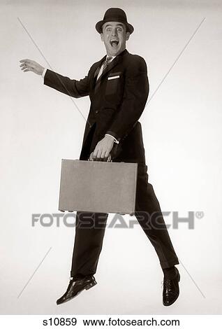 1960S Excited Man Businessman Wearing Hat And Holding Looking At Camera View Large Photo Image Stock Photo - 1960S Excited Man Businessman Wearing Hat And Holding Looking At Camera. Fotosearch