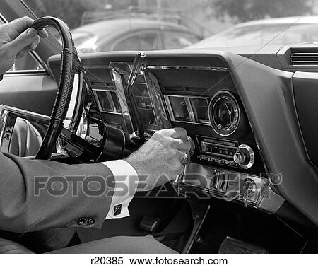 1960S Hand On Car Radio Dials And Steering Wheel View Large Photo Image Stock Photography - 1960S Hand On Car Radio Dials And Steering Wheel . Fotosearch