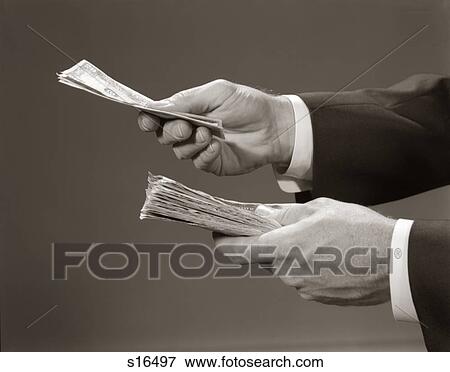 1960S Hands Close-Up Holding Stack Of Money Bank Notes Studio View Large Photo Image Stock Photo - 1960S Hands Close-Up Holding Stack Of Money Bank Notes Studio. Fotosearch