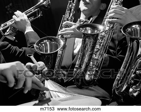 Stock Image - 1960S Hands Of Jazz Combo Playing Saxophone Trumpet & Cymbal With Wire Brush Drumstick. Fotosearch