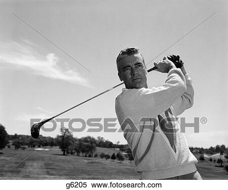 1960S Man Playing Golf Teeing-Off Golf Ball From Tee With Driver Outdoor View Large Photo Image Stock Photography - 1960S Man Playing Golf Teeing-Off Golf Ball From Tee With Driver Outdoor. Fotosearch