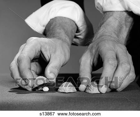 1960S Man'S Hands With Shirt Sleeves Rolled Up Playing Shell Game View Large Photo Image Stock Photo - 1960S Man'S Hands With Shirt Sleeves Rolled Up Playing Shell Game. Fotosearch