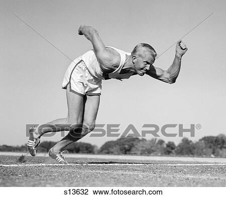 1960S Runner Coming Out Of Starting Position View Large Photo Image Stock Image - 1960S Runner Coming Out Of Starting Position. Fotosearch