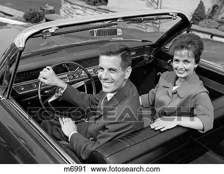 1960S Smiling Couple In Convertible Car Husband Wife Outdoor Looking At Camera View Large Photo Image Stock Image - 1960S Smiling Couple In Convertible Car Husband Wife Outdoor Looking At Camera. Fotosearch