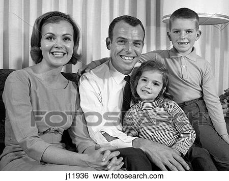 1960S Smiling Family Portrait Mother Father Son Daughter Looking At Camera View Large Photo Image Stock Photograph - 1960S Smiling Family Portrait Mother Father Son Daughter Looking At Camera. Fotosearch
