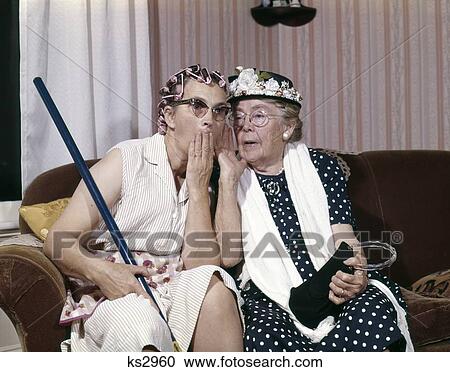 1960S Two Senior Older Women Sitting On Sofa Gossiping View Large Photo Image Stock Image - 1960S Two Senior Older Women Sitting On Sofa Gossiping. Fotosearch