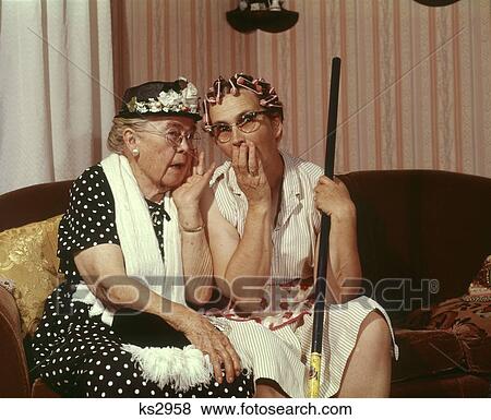 1960s Two Senior Older Women Sitting On Sofa Gossiping Stock Photo Ks2958 Fotosearch