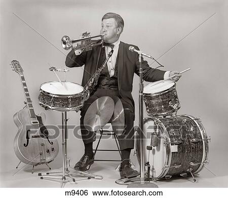 1970S One-Man Band Man In Tuxedo Blowing Trumpet Playing Drums Base Drum Cymbals View Large Photo Image Stock Photograph - 1970S One-Man Band Man In Tuxedo Blowing Trumpet Playing Drums Base Drum Cymbals. Fotosearch