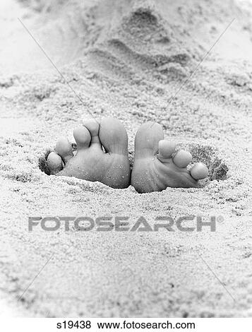 1970S Pair Of Adult Feet Sticking Out Of Sand On Beach Outdoor View Large Photo Image Stock Photo - 1970S Pair Of Adult Feet Sticking Out Of Sand On Beach Outdoor. Fotosearch